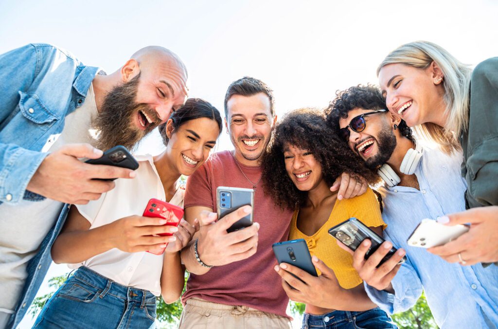 People looking at social media on their phones